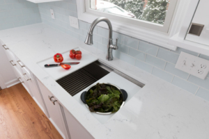 The top rack can be switched out with a panel (left of sink), which makes for even more counter space and added convenience.