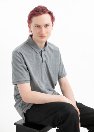 senior portrait of boy with dyed hair